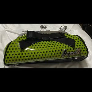 Sourpuss dark green shoulder purse with black polka dots.